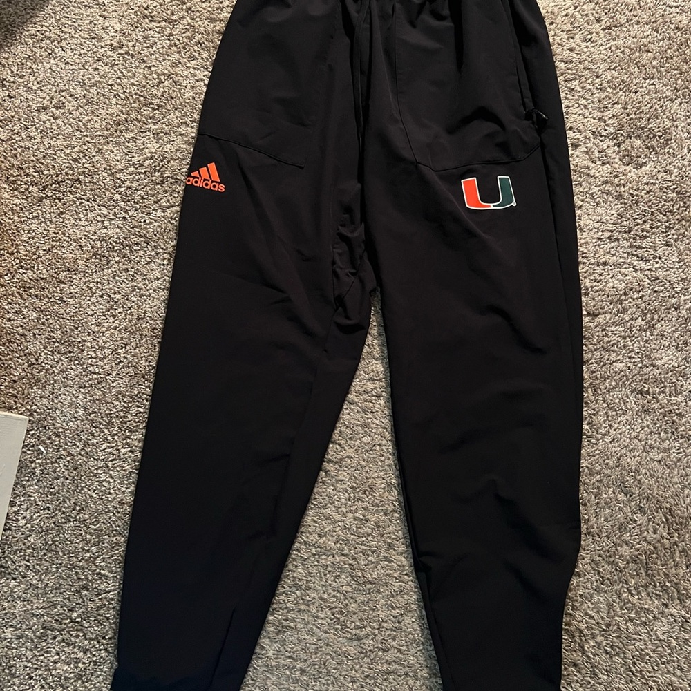 University of Miami Adidas Black Joggers with Orange and Green Logo